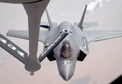 Photograph of a USAF F-35 being refueled by a KC-135 aerial tanker aircraft.