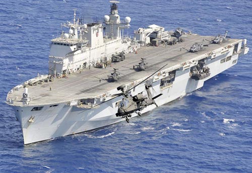 Photograph of at helicopter carrier warship at sea.